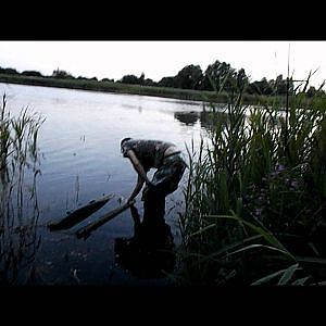 carp fishing and tench fishing on a lake full of weed