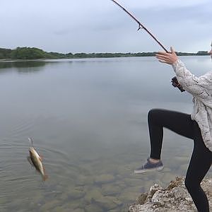 Teenage girl fishing for the first time and catches huge perch. Девушка ловит огромных окуней.